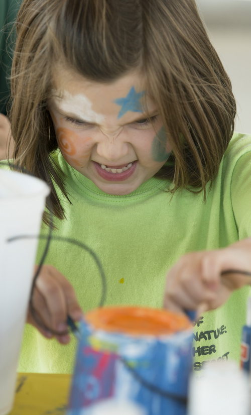 Rick Egan  |  The Salt Lake Tribune

Raina Hoaglin paints a craft project, in the kids art area, during the 2nd Annual Ogden Valley Roots & Blues Festival at Cutler Flats in Liberty on Sunday, August 24, 2014.  The three-day festival concluded Sunday.