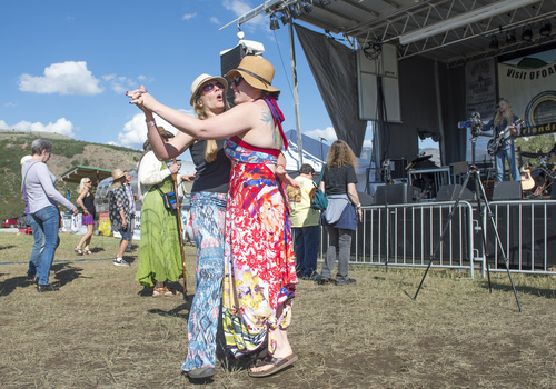 Rick Egan  |  The Salt Lake Tribune

Kara Martin, Ogden dances with her sister Filke Winney, Phoenix, at  the 2nd Annual Ogden Valley Roots & Blues Festival at Cutler Flats in Liberty on Sunday, August 24, 2014.  The three-day festival concluded Sunday.