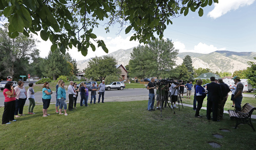 George Frey  |  Special to the Tribune
Neighbors, friends and family listen to a press conference by Cindy and Greg Thredgold talk about their son Connor Thredgold in front of their home on August 23, 2014, in Springville. Benjamin Thredgold was serving a mission for The Church of Jesus Christ of Latter-day Saints in Taiwan and was found dead in his apartment along with another missionary.