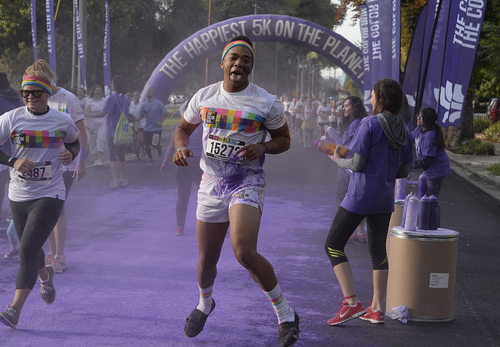 Scott Sommerdorf   |  The Salt Lake Tribune
Runners were pelted with purple just west of Liberty Park during the Color Run, Saturday, August 23, 2014.
