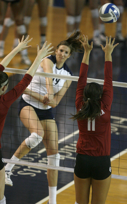 Rick Egan  | The Salt Lake Tribune 

Jennifer Hamson (19) spikes the ball as BYU faced Oklahoma in women's NCAA volleyball action at the Smith Fieldhouse in Provo, Saturday, December 1, 2012.