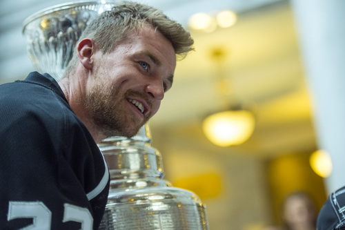 Chris Detrick  |  The Salt Lake Tribune
Los Angeles Kings' Trevor Lewis poses for pictures with fans and the Stanley Cup at the Utah State Capitol Wednesday August 27, 2014. Lewis is a Salt Lake City native who played for Brighton's club team as a freshman in 2002. Hockey tradition dictates that each member of the winning team gets custody of the Cup for one day.