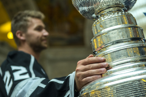 Chris Detrick  |  The Salt Lake Tribune
Los Angeles Kings' Trevor Lewis poses for pictures with the Stanley Cup at the Utah State Capitol Wednesday August 27, 2014. Lewis is a Salt Lake City native who played for Brighton's club team as a freshman in 2002. Hockey tradition dictates that each member of the winning team gets custody of the Cup for one day.