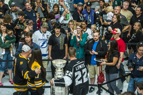 Chris Detrick  |  The Salt Lake Tribune
Los Angeles Kings' Trevor Lewis poses for pictures with fans and the Stanley Cup at the Utah State Capitol Wednesday August 27, 2014. Lewis is a Salt Lake City native who played for Brighton's club team as a freshman in 2002. Hockey tradition dictates that each member of the winning team gets custody of the Cup for one day.