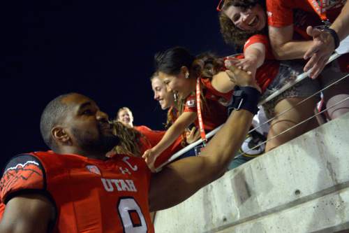 Chris Detrick  |  The Salt Lake Tribune
Utah Utes defensive end Nate Orchard (8) greets fans after the game at Rice-Eccles stadium Thursday August 28, 2014. Utah defeated Idaho State 56-14.