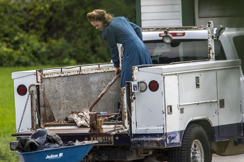Chris Detrick  |  The Salt Lake Tribune
A woman works on Wednesday, Aug. 20, 2014, outside the home near Pocatello, Idaho, where authorities removed nine FLDS boys. Their caretaker, Nathan C. Jessop, has been charged with three misdemeanor counts of child abuse.