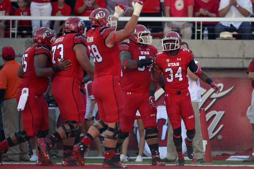 Chris Detrick  |  The Salt Lake Tribune
Utah Utes running back Bubba Poole (34) celebrates his touchdown during the first half of the game at Rice-Eccles stadium Thursday August 28, 2014. Utah is winning the game 35-7.