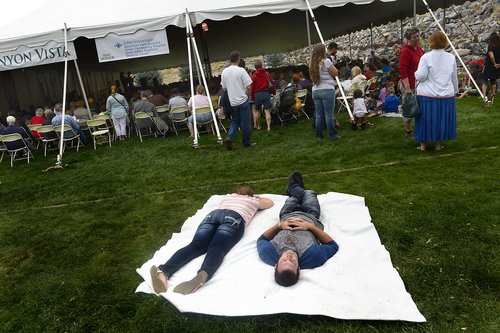 Scott Sommerdorf   |  The Salt Lake Tribune
Two festival goers take a nap during story time near the Canyon Vista tent at the annual Timpanogos Storytelling Festival finished up its three-day run on Saturday at Timpanogos Park, Saturday, August 30, 2014.
