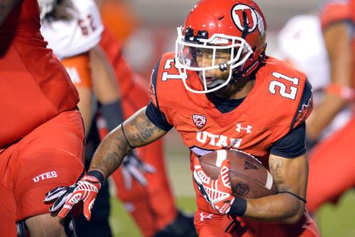 Chris Detrick  |  The Salt Lake Tribune
Utah Utes running back Troy McCormick (21) runs the ball during the second half of the game at Rice-Eccles stadium Thursday August 28, 2014. Utah defeated Idaho State 56-14.