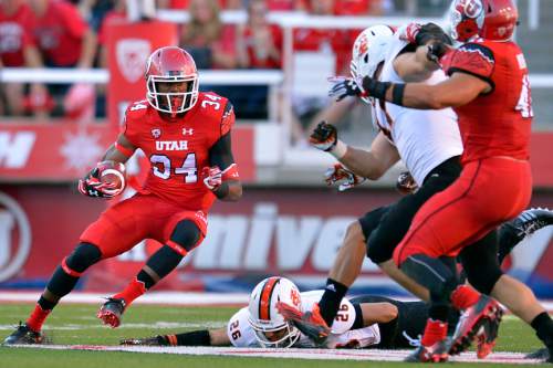 Chris Detrick  |  The Salt Lake Tribune
Utah Utes running back Bubba Poole (34) runs past Idaho State Bengals defensive back Michael Berger (26) during the first half of the game at Rice-Eccles stadium Thursday August 28, 2014. Utah is winning the game 35-7.