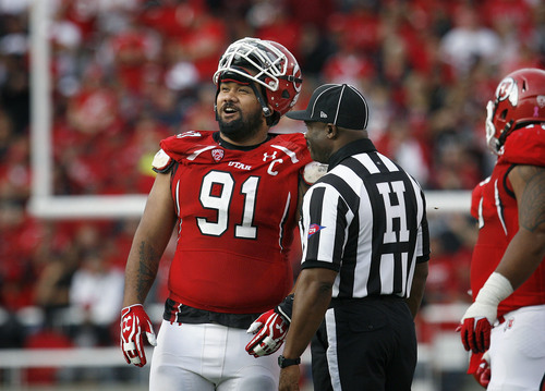 Scott Sommerdorf   |  The Salt Lake Tribune
Utah Utes defensive tackle Tenny Palepoi (91) talks with Pac-12 head linesman Edwin Walker in a game against Stanford on October 12, 2013. Palepoi was recently named to the San Diego Chargers' 53-man regular season roster.