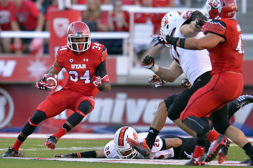 Chris Detrick  |  The Salt Lake Tribune
Utah Utes running back Bubba Poole (34) runs past Idaho State Bengals defensive back Michael Berger (26) during the first half of the game at Rice-Eccles stadium Thursday August 28, 2014. Utah is winning the game 35-7.