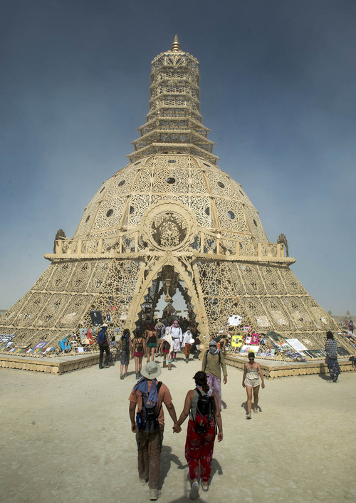 Rick Egan  |  The Salt Lake Tribune

A couple walks to the Temple of Grace at the Burning Man Festival in the Black Rock Desert, 100 miles north of Reno, Nev., Thursday, August 28, 2014.