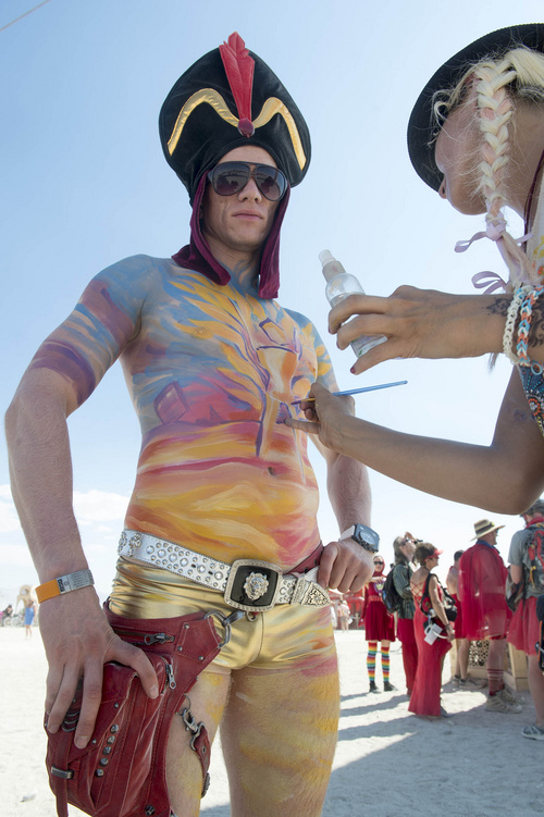 Rick Egan  |  The Salt Lake Tribune

Art has his chest painted by Lana Chromium at the Burning Man Festival in the Black Rock Desert, 100 miles north of Reno, Thursday, August 28, 2014.