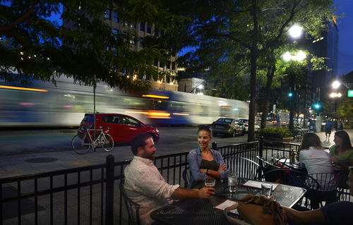 Scott Sommerdorf   |  The Salt Lake Tribune
Customers of The Beer Hive sit outside on Main Street in downtown Salt Lake City. Utah's capital is enjoying a resurgence in its night life amid an apartment building boom and residential population growth, spurred by 20- and 30-somethings drawn to urban living.