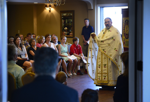 Scott Sommerdorf   |  The Salt Lake Tribune
Father Jimi Foreso from St. Catherine Greek Orthodox Church of Greenwood Village, Colorado led the inaugural worship service of the Greek Orthodox community's new Mission Parish at Woods on Ninth, Sunday, August 31, 2014.