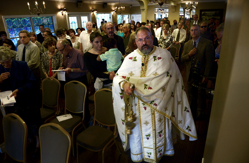 Scott Sommerdorf   |  The Salt Lake Tribune
Father Jimi Foreso from St. Catherine Greek Orthodox Church of Greenwood Village, Colorado led the inaugural worship service of the Greek Orthodox community's new Mission Parish at The Woods on Ninth, Sunday, August 31, 2014.