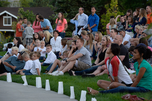 Francisco Kjolseth  |  The Salt Lake Tribune
People gather for a memorial service marking the one-year anniversary of Draper police Sgt. Derek Johnson's death at the Draper Historic Park on Labor Day.
