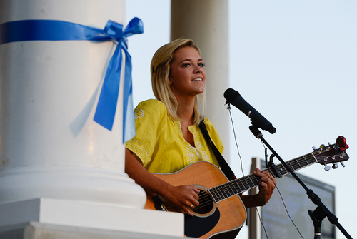 Francisco Kjolseth  |  The Salt Lake Tribune
Kenz Hall, and American Idol Contestant sings during a memorial service marking the one-year anniversary of Draper police Sgt. Derek Johnson's death at the Draper Historic Park on Labor Day.