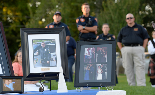 Francisco Kjolseth  |  The Salt Lake Tribune
People gather for a memorial service marking the one-year anniversary of Draper police Sgt. Derek Johnson's death at the Draper Historic Park on Labor Day.