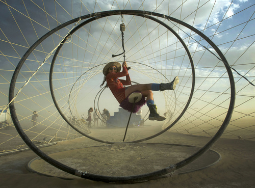 Rick Egan  |  The Salt Lake Tribune

Morgn Russon, Denver, rides a zioline through the "Zymphonic Wormhole" at the Burning Man festival in the Black Rock Desert, north of Reno, August 30, 2014.