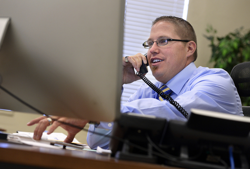 Scott Sommerdorf   |  The Salt Lake Tribune
Tintic School Superintendent Kodey Hughes takes calls in his office, Thursday, August 21, 2014. The office used to be the 5th and 6th grade classroom he sat in as a kid. Hughes is one of the youngest superintendents in the state if not the youngest, and he started in the district as a special education student.
