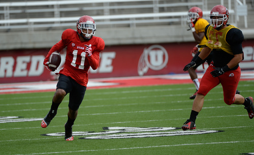 Francisco Kjolseth  |  The Salt Lake Tribune
Wide receiver Kaelin Clay of the University of Utah football team leaves the defense behind during practice at Rice-Eccles Stadium on Tuesday morning, Aug. 12, 2014.