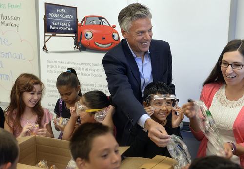 Scott Sommerdorf   |  The Salt Lake Tribune
Jon Huntsman Jr.distributes the contents of a science-related box of teaching materials to Melody Francis' 4th grade classroom at Rose Park Elementary in association with Chevron's 2014 Fuel Your School Program, Wednesday Sept. 3, 2014. Huntsman has been a U.S. Ambassador to China and Utah's Governor and is currently a Chevron Board of Directors Member. In front of Ambassador Hunstman is Hassan Hamid, 9, trying on laboratory goggles. Natalie Richards, 9, is at far left. Fourth grade teacher Melody Francis is at far right.
