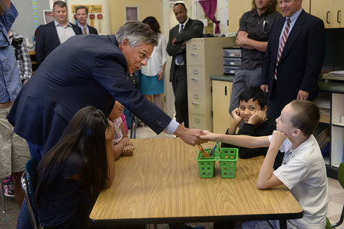 Scott Sommerdorf   |  The Salt Lake Tribune
Jon Huntsman Jr. reached out to introduce himself to fourth grader Noah Wilson, 9, as Huntsman helped deliver teaching materials to Melody Francis' 4th grade classroom at Rose Park Elementary in association with Chevron's 2014 Fuel Your School Program, Wednesday Sept. 3, 2014. Huntsman has been a U.S. Ambassador to China and Utah's Governor and is currently a Chevron Board of Directors Member. Hassan Hamid, 9, is second from right.