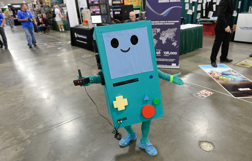 Franciso Kjolseth  |  Tribune file photo
Izra'il Peña the little video game "BMO from Adventure Time," gets the cutest award as thousands of fiction fans from near and far gather at the Salt Palace Convention Center for day two of Salt Lake Comic Con's FanX.