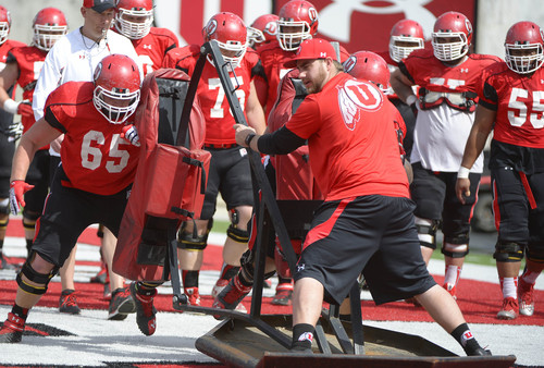 Leah Hogsten  |  The Salt Lake Tribune
Parker Erickson moves the sled with Jeremiah Poutasi.  The University of Utah football team practices Tuesday, April 15, 2014, at Rice-Eccles Stadium.