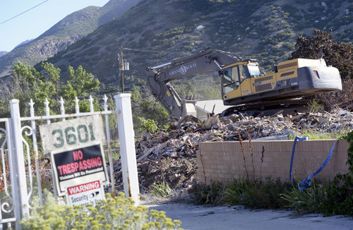 Al Hartmann  |  The Salt Lake Tribune
A last look at  former Salt Lake County home- polygamist compound of Rulon Jeffs  at 3601 E. Little Cottonwood Road. Demolition started Wednesday September 3 to make way for new homes.  Large backhoe demolishes Rulon Jeffs residence the first building to go on the 4.5 acre property.