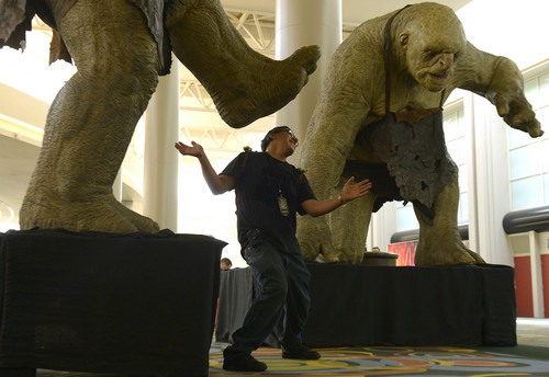 Leah Hogsten  |  The Salt Lake Tribune
Jayson Morales of Ogden poses next to the WETA's giant trolls. Scenes of cosplay September 4, 2014, during the second annual Comic Con, Sept. 4-6, at the Salt Palace Convention Center.