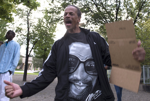 Rick Egan  |  The Salt Lake Tribune

Oscar Ross, shouts along with other protesters, in solidarity with Mike Brown, Dillon Taylor, Danielle Willard and others who they feel were killed unjustly by police. Monday, August 25, 2014.