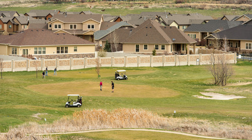 Trent Nelson  |  The Salt Lake Tribune
South Jordan residents are attempting to save Mulligans Golf Course and the open space it sits on, all owned by South Jordan, from development. Golfers played the course near an adjacent development Saturday March 29, 2014.
