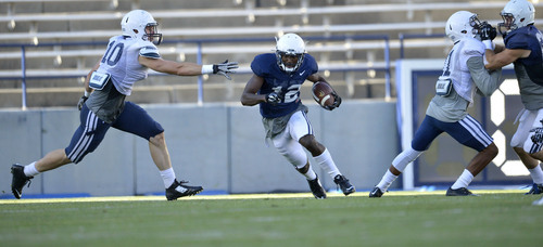 Chris Detrick  |  The Salt Lake Tribune
Brigham Young Cougars wide receiver Devon Blackmon (12) runs the ball during a scrimmage at LaVell Edwards Stadium Friday August 15, 2014.
