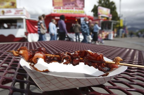 Trent Nelson  |  The Salt Lake Tribune
"Deep-fried chocolate covered bacon on a stick," served  from J&J Concessions at the Utah State Fair in 2010.