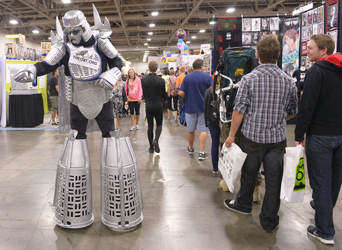 Leah Hogsten  |  The Salt Lake Tribune
Set and costume designer Robert Reins gingerly walks the aisles dressed as "Megalatron" during the second annual Comic Con, Sept. 4, 2014, at the Salt Palace Convention Center.