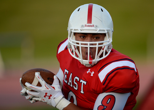 Francisco Kjolseth  |  The Salt Lake Tribune
East High's Hausia Sekona celebrates a touch down agains Jordan in game action on Friday, Aug. 29, 2014, at East.