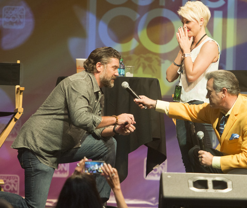 Rick Egan  |  The Salt Lake Tribune

Jarrod Phillips proposes to his girlfriend, Melissa Johnson, with a little help from Bruce Campbell, during Comic Con, at the Salt Palace, Friday, September 5, 2014.