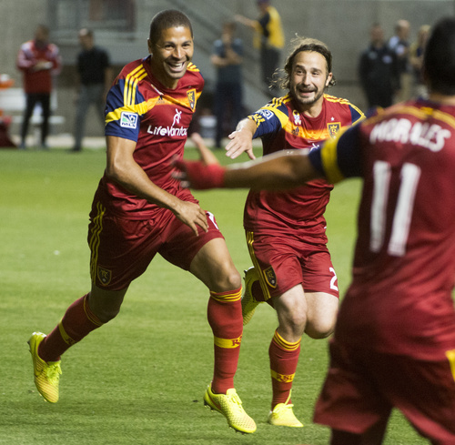 Rick Egan  |  The Salt Lake Tribune

Real Salt Lake midfielder Ned Grabavoy (20) chases Real Salt Lake forward Alvaro Saboru (15) as they celebrate Saboru's goal, with Javier Morales (11), giving Real Salt Lake a 2-1 lead with a goal late in the second half, in MLS action, Real Salt Lake vs. FC Dallas , at Rio Tinto Stadium, Thursday, September 6, 2014