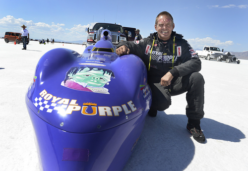 Scott Sommerdorf   |  The Salt Lake Tribune
Driver Mike Nish poses next to the Nish Racing car as he waits in line for their turn to make an attempt at the Utah Salt Flats Racing Association World of Speed, Sunday, September 7, 2014. The car had to cut it's first run short due to a mechanical issue.