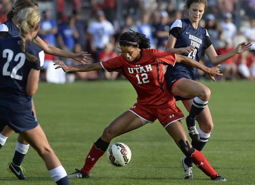 Scott Sommerdorf   |  The Salt Lake Tribune
Utah's Baylee Neilson, 12, is attacked by BYU's Stephanie Ringwood, right during second half play. Katie Taylor scored on a second half penalty kick, and Utah women's soccer defeated BYU 1-0 in Salt Lake City, Friday, September 5, 2014.