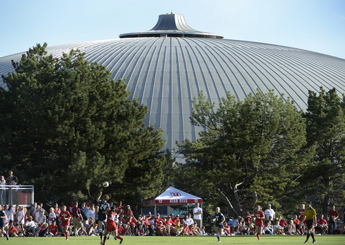 Scott Sommerdorf   |  The Salt Lake Tribune
The Huntsman Center looms in the background as Utah plays BYU in women's soccer. Katie Taylor scored on a second half penalty kick, and Utah women's soccer defeated BYU 1-0 in Salt Lake City, Friday, September 5, 2014.