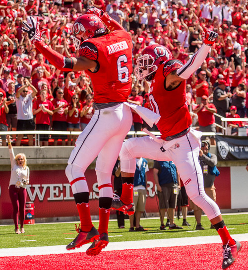 Trent Nelson  |  The Salt Lake Tribune
Utah Utes wide receiver Dres Anderson (6) celebrates his first quarter touchdown with teammate Utah Utes wide receiver Delshawn McClellon (10) as Utah hosts Fresno State, college football at Rice-Eccles Stadium Saturday September 6, 2014.