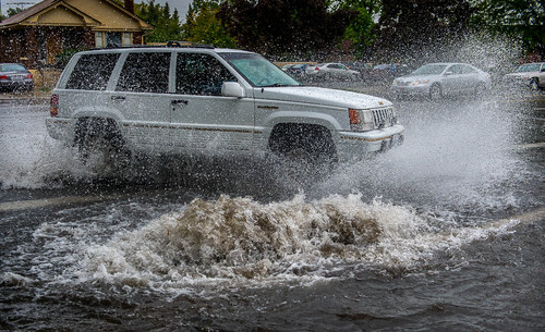 Trent Nelson  |  The Salt Lake Tribune
An SUV drives through high water at 800 North and 150 East during a rainstorm in Provo, Tuesday September 9, 2014.