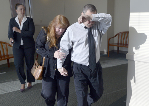 Al Hartmann  |  The Salt Lake Tribune
Robert and Tammy Enlert, parents of Alicia Englert, accused of throwing her baby in the trash earlier this month, leave court after their daughter makes her initial appearance in Judge Ann Boyden's courtroom in Salt Lake City Wednesday Septmeber 10.
