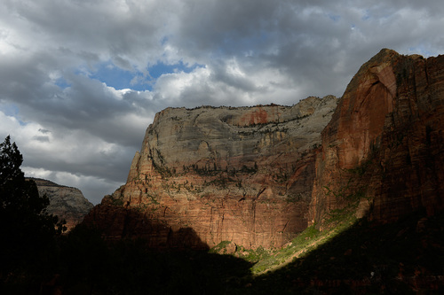 Franciso Kjolseth  |  The Salt Lake Tribune
Steep cliffs undergo a constant transformation as the sun flashes through clouds, illuminating the famed landscape along Zion Canyon.