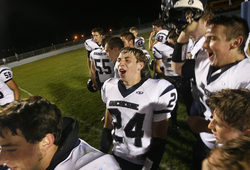 Scott Sommerdorf   |  The Salt Lake Tribune
Duchesne RB Dylan Despain, center, celebrates with team mates after their 35-0 win against Carbon High to run their winning streak to 37 games, and setting the Utah state record for consecutive wins, Friday, September 6, 2013.