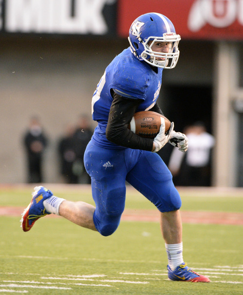 Steve Griffin  |  The Salt Lake Tribune


Bingham running back Scott Nichols sweeps the ball around the end on his way to a touchdown during second half action in the 5A championship football game against Brighton at Rice Eccles Stadium in Salt Lake City, Utah Friday, November 22, 2013.
